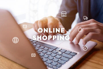 Man using laptop for online shopping with levitating icons and text. Modern e-commerce concept for...