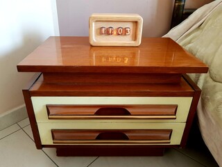 Wooden chest of drawers in the bedroom. Furniture for bedroom.