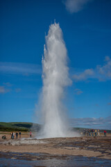 Geyser Park in Iceland. Stokkur eruption with sunstar in a beautiful sunny day in winter.