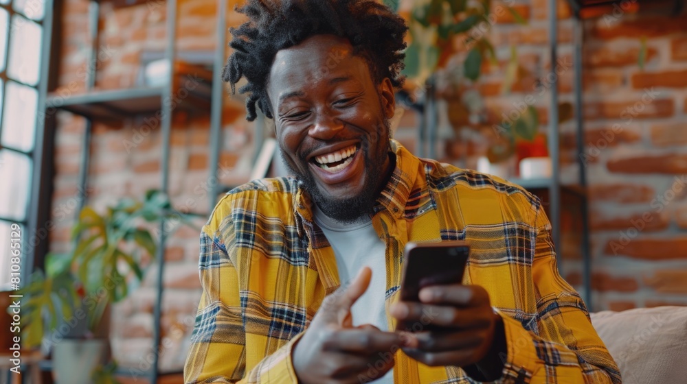Aufkleber a man smiling while looking at his cell phone. suitable for technology concepts