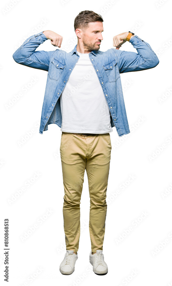 Sticker Handsome man with blue eyes and beard wearing denim jacket showing arms muscles smiling proud. Fitness concept.