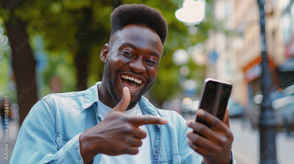 Poster a man pointing at his cell phone. suitable for technology concepts