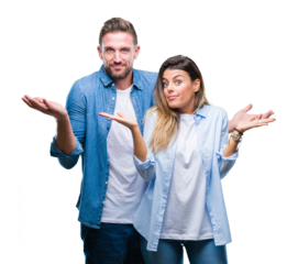 Young couple in love over isolated background clueless and confused expression with arms and hands raised. Doubt concept.