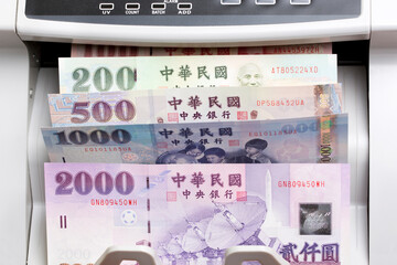 Taiwan dollar in a counting machine