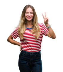 Young beautiful blonde woman over isolated background showing and pointing up with fingers number two while smiling confident and happy.