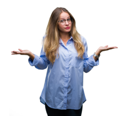 Young beautiful blonde business woman wearing glasses over isolated background clueless and confused expression with arms and hands raised. Doubt concept.