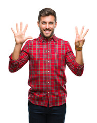 Naklejka premium Young handsome man over isolated background showing and pointing up with fingers number eight while smiling confident and happy.
