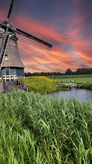Naklejka premium Mill on the river at dawn.