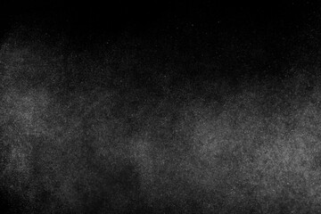 Grunge black and texture background. Dark textured pattern. Abstract dust overlay. Light powder explosion.		