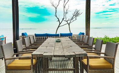 Fototapeta premium table and chairs on the beach, sanur bali