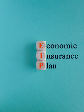 Concept red words EIP economic insurance plan on beautiful wooden cubes. Beautiful blue background. Business EIP economic insurance plan concept. Copy space.
