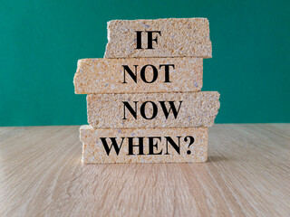 If not now when symbol. Concept words If not now when on brick blocks. Beautiful green background,...