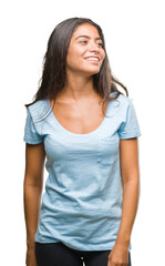 Fototapeta premium Young beautiful arab woman over isolated background looking away to side with smile on face, natural expression. Laughing confident.