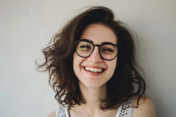 Fototapeta premium Smiling woman with glasses and curly hair posing for a photo Fictional Character Created By Generative AI. 