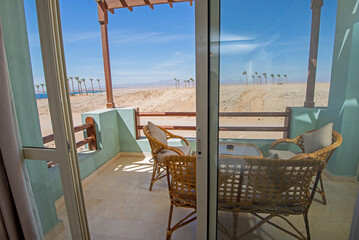 Terrace balcony with chairs in tropical luxury apartment resort