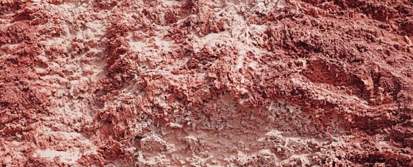 A mountainous sandy surface. Natural reddish texture