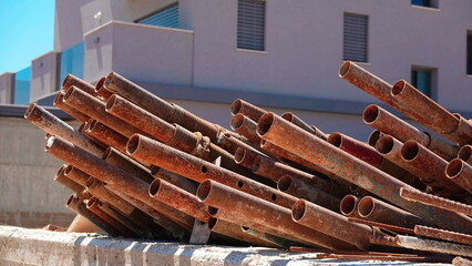 Rusty Construction Pipes Piled Site Close-Up