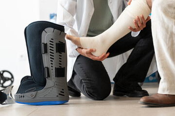 Man tries on an orthopedic boot at the pharmacy
