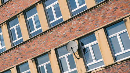 ARCHITECTURE - Brick wall and windows of an old modernist building
