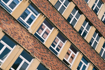 ARCHITECTURE - Brick wall and windows of an old modernist building
