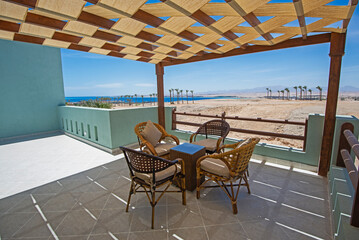 TRoof terrace balcony with chairs in tropical luxury apartment resort