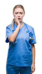 Young blonde surgeon doctor woman over isolated background touching mouth with hand with painful expression because of toothache or dental illness on teeth. Dentist concept.