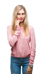 Young beautiful blonde woman wearing pink winter sweater over isolated background touching mouth with hand with painful expression because of toothache or dental illness on teeth. Dentist concept.