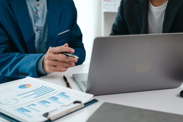 A team of young entrepreneurs and Asian startups held a business meeting. to achieve the marketing plan Businessmen talking in a conference room. Business. Population. Company.