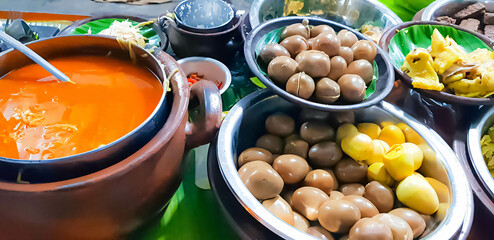 dishes served in Indonesian food Liwet Rice. Traditional javanese Rice Served with Chicken, Tofu, Tempeh, vegetable, Chili, egg