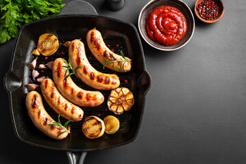 Grilled sausages on grill pan