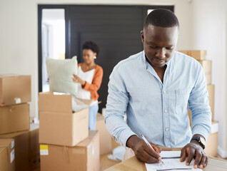 African, couple and boxes on checklist in apartment for moving, house and relocation on couch in...