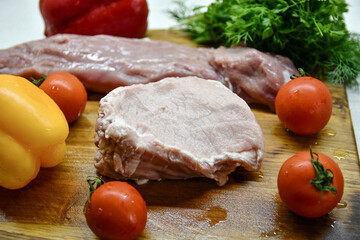 Photo of raw meat with fresh vegetables