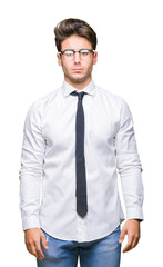 Young business man wearing glasses over isolated background skeptic and nervous, frowning upset because of problem. Negative person.