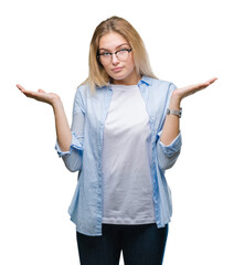 Young caucasian business woman wearing glasses over isolated background clueless and confused...