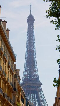 A French landmark in the central district of the French capital Paris. Renovated Eiffel Tower in 2024. Tourist place in Paris. Low angle view of the Eiffel Tower