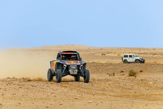 Al-Kharj, Saudi Arabia - January 10, 2023: The MCE-5 Development T3M racing car of Red Bull Off-Road JR Team USA running Stage 9 of the Dakar Rally 2023 Edition.