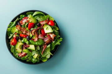 Fresh Salad in a Bowl on Blue Background