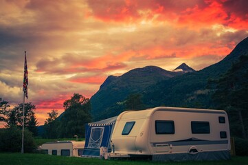 Sunset Sky Over Campground with Travel Trailers