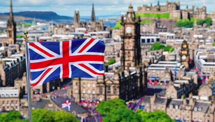 Fototapeta premium the flag of Great Britain on the background of the city of Edinburgh. Fringe Arts Festival in Edinburgh