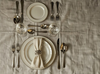
table with plates glasses cutlery napkin