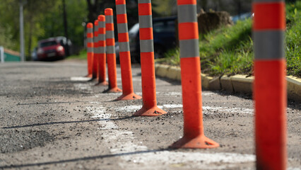 Signal, orange cones along the road