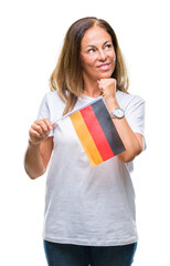 Middle age hispanic woman holding flag of Germany over isolated background serious face thinking about question, very confused idea