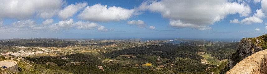 Obraz premium Panoramic photography from the top of Monte Toro, the highest mountain in Menorca. The town photographed, Es Mercadal. Fantastic views of most of the coastline. Menorca, Spain