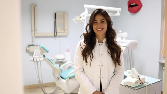 Video portrait of a beautiful, young female dentist at her office