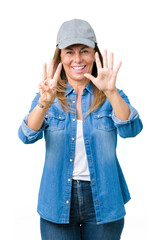 Beautiful middle age woman wearing sport cap over isolated background showing and pointing up with fingers number eight while smiling confident and happy.