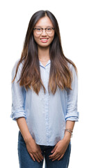 Young asian business woman wearing glasses over isolated background with a happy and cool smile on face. Lucky person.