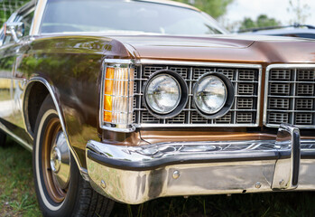 Close up of a vintage car headlights. Classic vehicle. Oldtimer car.	