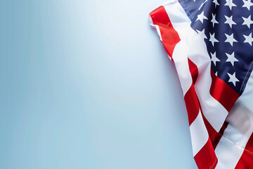 Soft blue background provides a serene setting  an American flag Memorial Day tribute.