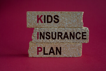 KIP kids insurance plan symbol. Concept words KIP kids insurance plan on brick blocks. Beautiful red background. Business KIP kids insurance plan concept.