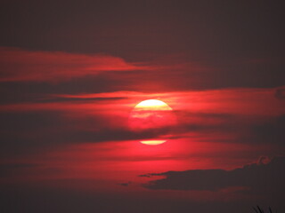 The sun is set  and the clouds on the evening moody orange sky,  amazing nature picture